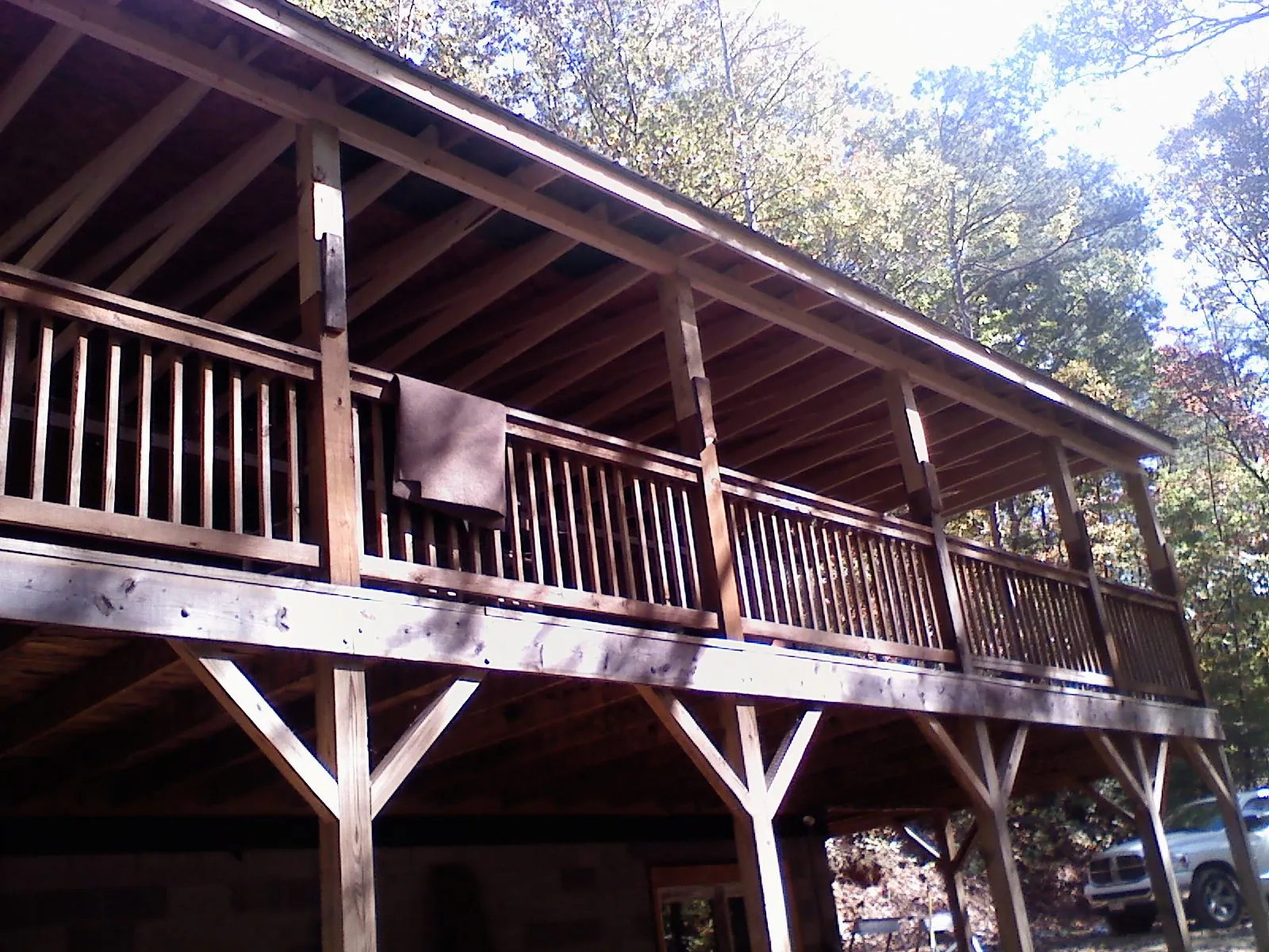 Timber framing under a new elevated porch and deck — Roof Leak Repair in Hustle by Roofing Brothers
